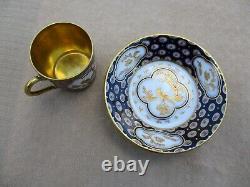 BERNARDAUD & Co LIMOGES BLUE AND GOLD ENCRUSTED DEMITASSE COFFEE CUP AND SAUCER